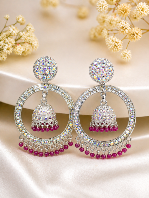 Trendy statement jhumka earrings for women with colorful stones and pink beads Designer jhumka earrings for party wear with luxury crystal shine Beautiful desi jhumka earrings with detailed stone work and hanging beads